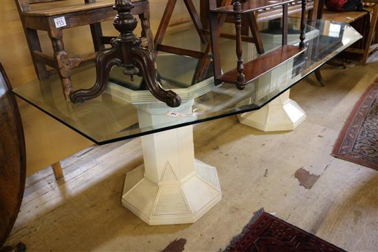 A modern twin pillar glass topped dining table, W.7ft 10in. D.3ft 11in.